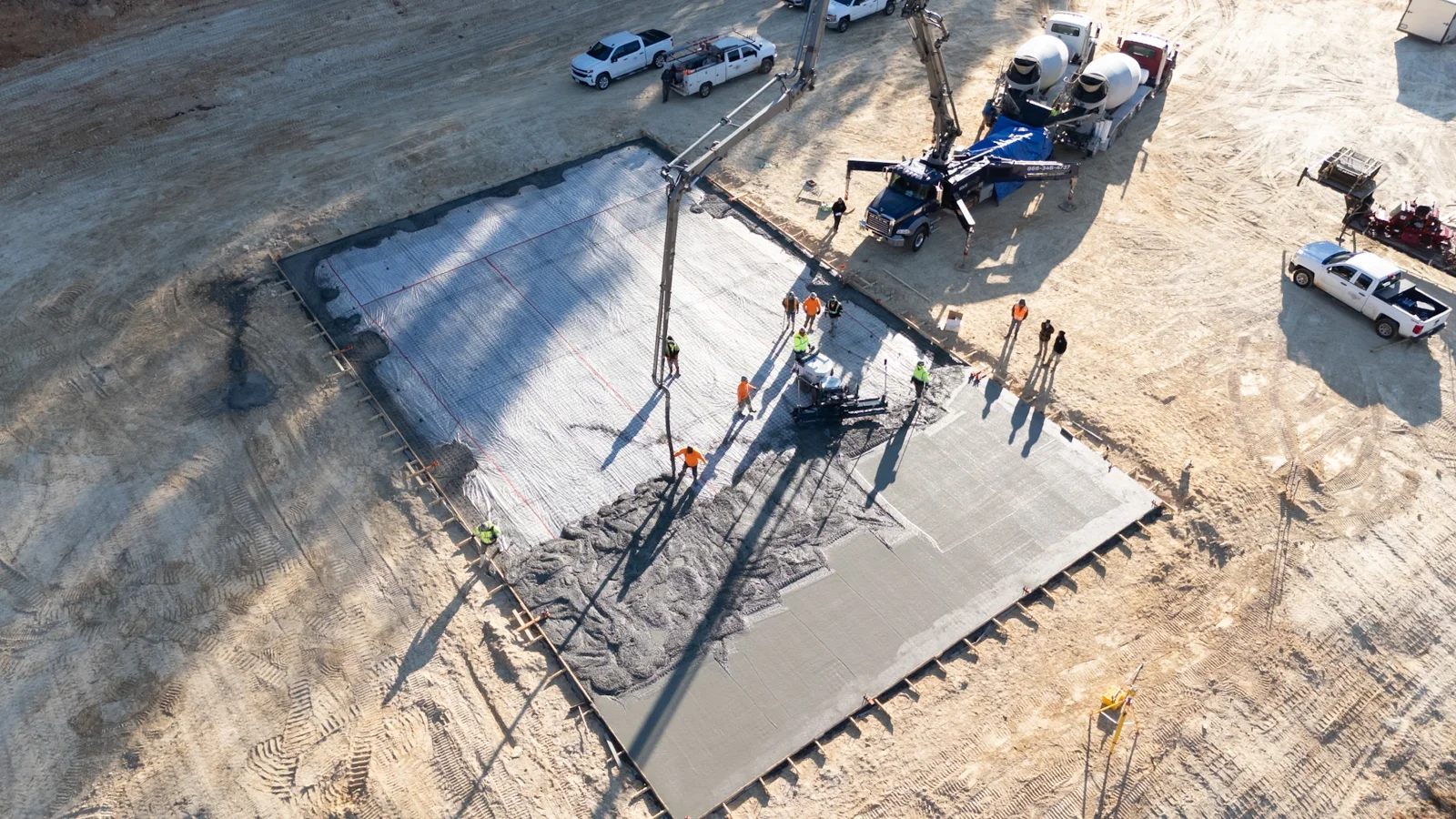 Solid Solutions crew placing a concrete building slab